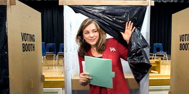 Democratic Congresswoman Loretta Sanchez emerges from a voting booth after casting her ballot at Santiago Elementary School in Santa Ana, Calif. on Tuesday, Nov. 2, 2010. (AP Photo/The Orange County Register, H. Lorren Au Jr. )