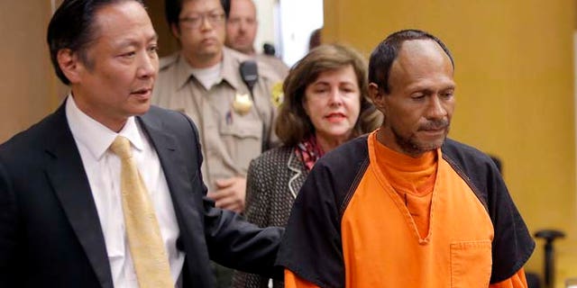 FILE - In this Tuesday, July 7, 2015 file photo, Juan Francisco Lopez-Sanchez, right, is lead into the courtroom by San Francisco Public Defender Jeff Adachi, left, and Assistant District Attorney Diana Garciaor, center, for his arraignment at the Hall of Justice in San Francisco. (Michael Macor/San Francisco Chronicle via AP, Pool, File)