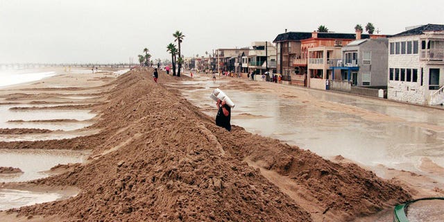 A sand dike protects the Orange County beach