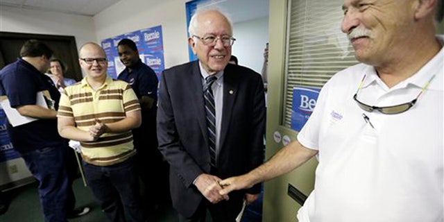 Democratic presidential candidate Sen. Bernie Sanders greets supporters at an open house at his Iowa campaign headquarters, Saturday, June 13, 2015, in Des Moines, Iowa. (AP Photo/Charlie Neibergall)