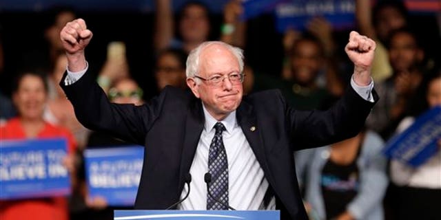 Democratic presidential candidate, Sen. Bernie Sanders, I-Vt. acknowledges his supporters on arrival at a campaign rally, Tuesday, March 8, 2016, in Miami. (AP Photo/Alan Diaz)