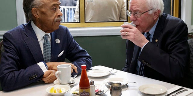 Feb. 10,, 2016: The Rev. Al Sharpton talks with Democratic presidential candidate Sen. Bernie Sanders, I-Vt. as they sit down for a breakfast meeting at Sylvia's Restaurant in the Harlem neighborhood of New York.