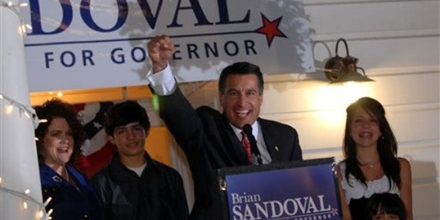 Nevada gubernatorial candidate Brian Sandoval celebrates his victory over incumbent Gov. Jim Gibbons in the GOP primary at the Garden Shop Nursery in Reno, Nev., June 8. (AP Photo)
