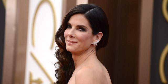FILE - In this March 2, 2014 file photo, Sandra Bullock arrives at the Oscars at the Dolby Theatre, in Los Angeles. Bullock's ordeal of waking up with a man inside her home in June 2014 comes to life in 911 call audio and copies of the man's writings about the actress revealed in a court hearing on Thursday released by the Los Angeles Superior Court Friday, April 10, 2015. (Photo by Jordan Strauss/Invision/AP, File)