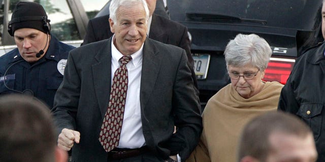 Dec. 13, 2011: Jerry Sandusky, left, the former Penn State assistant football coach charged with sexually abusing boys, arrives with his wife, Dottie Sandusky, for a preliminary hearing at the Centre County Courthouse in Bellefonte, Pa., where he will face his accusers.