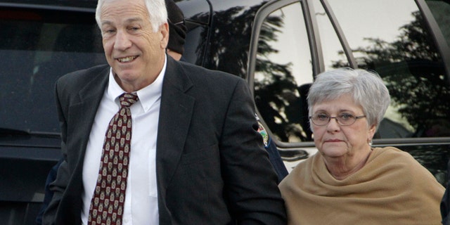 Dec. 13, 2011: In this file photo, former Penn State assistant football coach Jerry Sandusky arrives with his wife, Dottie Sandusky, for a preliminary hearing at the Centre County Courthouse in Bellefonte, Pa.