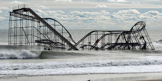 Nov. 1, 2012: The remnants of a roller coaster sits in the surf three days after Hurricane Sandy came ashore in Seaside Heights, New Jersey.