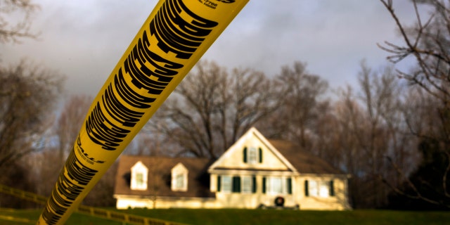 Crime scene tape is posted outside Nancy Lanza's Sandy Hook Village home in Newtown, Conn.