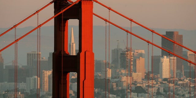 The skyline of San Francisco, California showing the Transamerica Building framed by the north tower of the Golden Gate Bridge is pictured at sunset Feb. 27, 2008. 