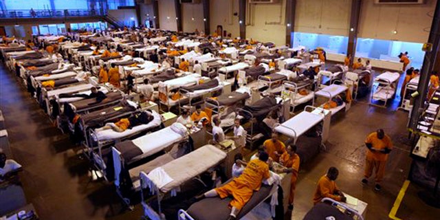 In this May 20, 2009 file photo, several hundred inmates crowd the gymnasium at San Quentin prison in San Quentin, Calif.