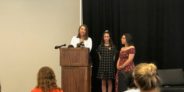 17-year-old junior Megan McGuire (left) was joined by 18-year-old seniors Bree Butler (center) and Kennedy Rodriguez (right) as they called for gun reform.