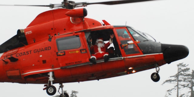 Coast Guard Master Chief Petty Officer Frank Allard arrives at the mall dressed as Santa in 2010.