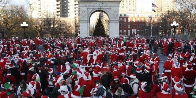 SantaCon revelers gathered in cities across the nation dressed en masse as jolly ol' St. Nick. (Reuters)