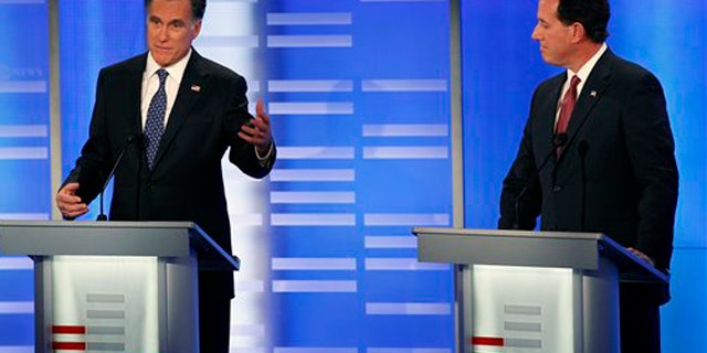 Jan. 7, 2012: Former Massachusetts Gov. Mitt Romney, left, answers a question as former Pennsylvania Sen. Rick Santorum listens during a Republican presidential candidate debate at Saint Anselm College in Manchester, N.H.