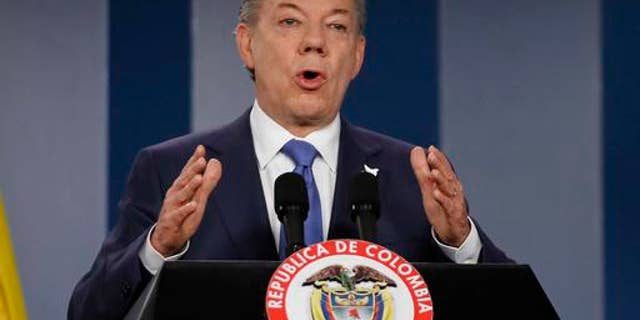 FILE - In this Wednesday, Oct. 4, 2016 file photo Colombiaâs President Juan Manuel Santos delivers a statement to the press after meeting with former President Alvaro Uribe and other opposition leaders at the presidential palace in Bogota, Colombia. Colombian President Juan Manuel Santos has won Nobel Peace Prize it was announced on Friday Oct. 7, 2016. (AP Photo/Fernando Vergara, File)