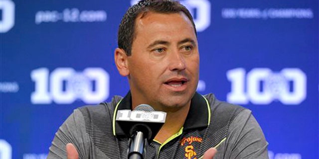 FILE - In this July 31, 2015, file photo, Southern California coach Steve Sarkisian speaks to reporters during NCAA college Pac-12 Football media days in Burbank, Calif. (AP Photo/Mark J. Terrill, File)