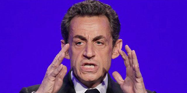 April 5, 2012: France's President and candidate for re-election in 2012, Nicolas Sarkozy, gestures as he speaks to reporters during a press conference as part of his presidential campaign in Paris.