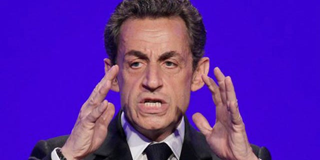 April 5, 2012: France's President and candidate for re-election in 2012, Nicolas Sarkozy, gestures as he speaks to reporters during a press conference as part of his presidential campaign in Paris.