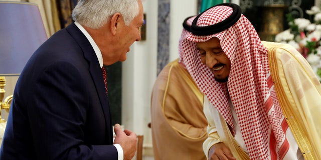 U.S. Secretary of State Rex Tillerson and Saudi King Salman smile before their meeting in Riyadh, Saudi Arabia, October 22, 2017.