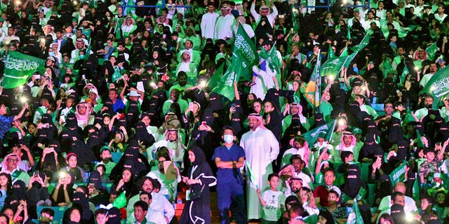 Saudi men and women attend national day ceremonies at the King Fahd stadium in Riyadh.