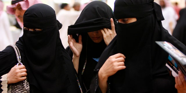 FILE 2010: Saudi women visit the Saudi Travel and Tourism Investment Market fair in Riyadh, Saudi Arabia.