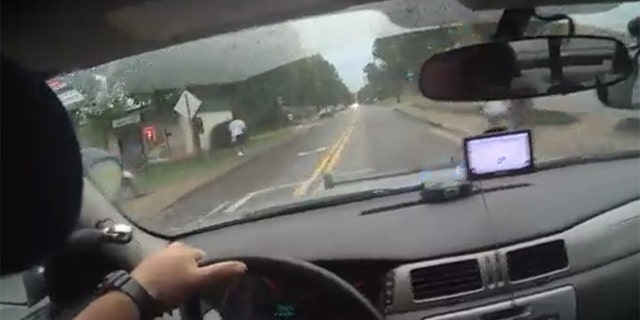 Image from bodycam video showing Athens-Clarke County Police Officer Taylor Saulters in pursuit of a suspect Friday in east Athens.