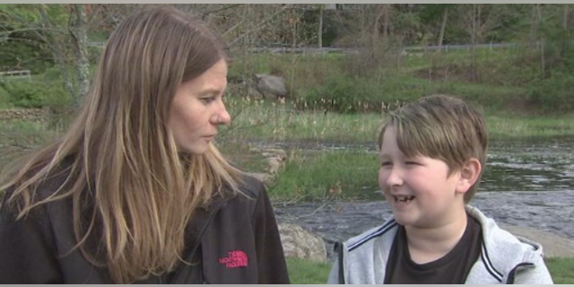 Michael O'Brien Jr., pictured right, saved his mother who was choking on a muffin.