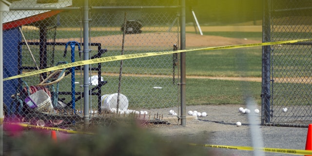 Softballs are strewn on a field at the scene of a multiple shooting involving a member of House Majority Whip Steve Scalise of La., Wednesday, June 14, 2017, in Alexandria, Va.