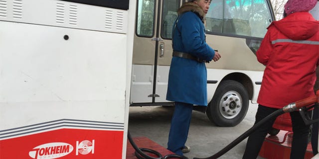 FILE 2016: A customer talks to a gas station attendant in Pyongyang, North Korea.