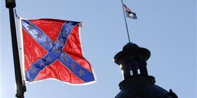 FILE: A Confederate flag flies atop the north end of the South Carolina Statehouse in Columbia