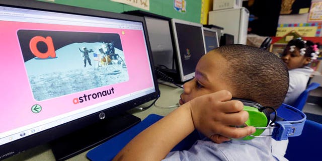 Friday, March 1, 2013: In this photo, Jason Hayes works on a computer in his prekindergarten class at a public school in Buffalo, N.Y. President Barack Obama's proposal to expand access to preschool is seen as a way to close the achievement gap for poor and minority students, improve high school graduation rates and ultimately strengthen the workforce.
