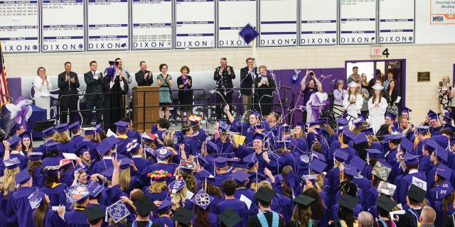Dixon High School's Class of 2018 celebrates their graduation at the school in Dixon, Ill., Sunday, May 20, 2018.