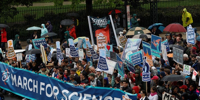 Demonstrators march to the U.S. Capitol during the March for Science in Washington, U.S., April 22, 2017. REUTERS/Aaron P. Bernstein - RTS13GY0