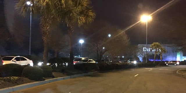 Shoppers exit the grounds of the Columbiana Mall at Harbison in Columbia, S.C. after reports of an active shooter (Wayne Shuler)