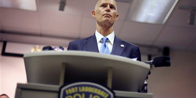 Florida Gov. Rick Scott is shown at a ceremony at a Fort Lauderdale, Fla., police station June 3.