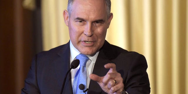 FILE - In this Feb. 21, 2017, file photo, Environmental Protection Agency (EPA) Administrator Scott Pruitt speaks to employees of the EPA in Washington. Pruitts schedule shows he met with Dow CEO Andrew Liveris for about a half hour on March 9 during a conference held at a Houston hotel. Twenty days later Pruitt announced his decision to deny a petition to ban Dows chlorpyrifos pesticide from being sprayed on food, despite a review by his agencys own scientists that concluded ingesting even minuscule amounts of the chemical can interfere with the brain development of fetuses and infants. EPA released a copy of Pruitts March meeting schedule earlier this month following several Freedom of Information Act requests. (AP Photo/Susan Walsh, File)