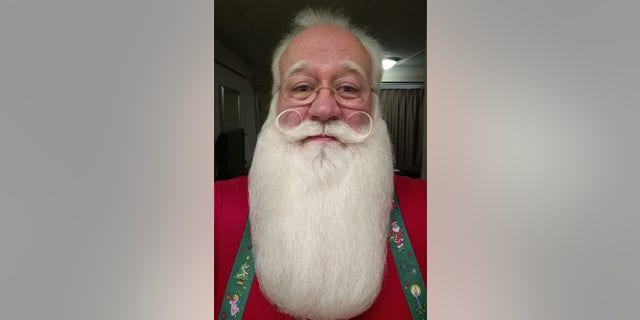Eric Schmitt-Matzen volunteers as Santa Claus at a local Tennessee hospital.