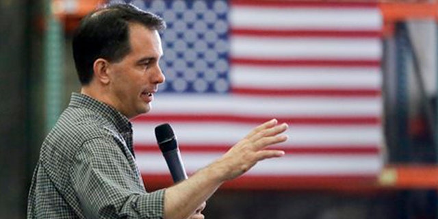 Republican presidential candidate Wisconsin Gov. Scott Walker addresses a crowd at Giese Manufacturing, Sunday, July 19, 2015, in Dubuque, Iowa.