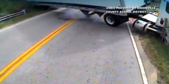 The semi-truck can be seen swerving out of control in this surveillance video.