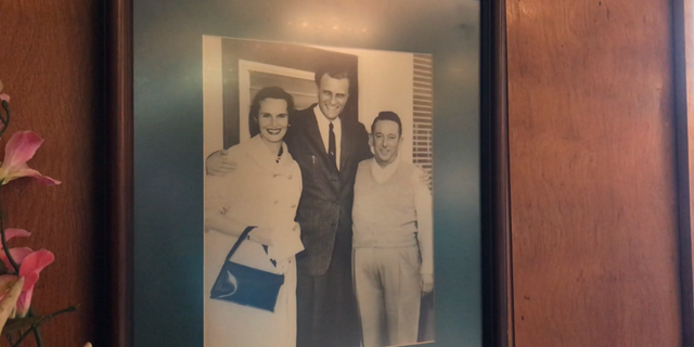 Billy Graham and his wife Ruth with restaurant owner "Red Bridges" in the late 50s.