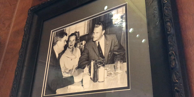 Billy Graham and his wife Ruth having lunch with Representative Basil Whitner (D-SC) in the late 50's. Shelby, NC