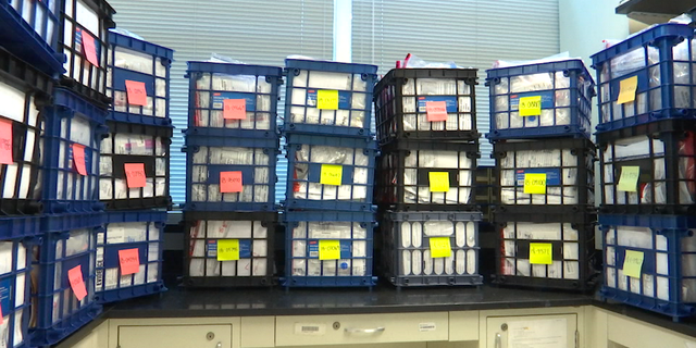 Crates of drug evidence awaiting analysis fill several rooms at GBI headquarters in Decatur, Ga.