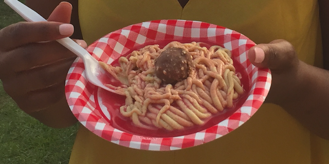 This dessert dish is a fun take on cookie dough in the form of a plate of spaghetti and meatballs with red sauce. Cookie dough spaghetti noodles are topped with a Ferrero Rocher chocolate "meatball," while the red sauce is substituted with a strawberry dessert sauce.