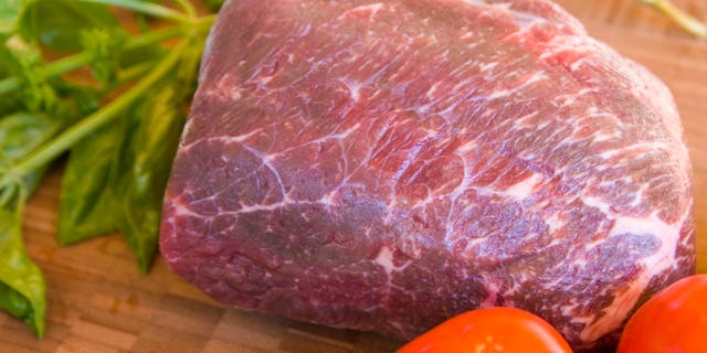 Lean piece of buffalo rump roast prepared to be grilled or roasted. This lean meat is very healthy and acceptable to those watching their weight.