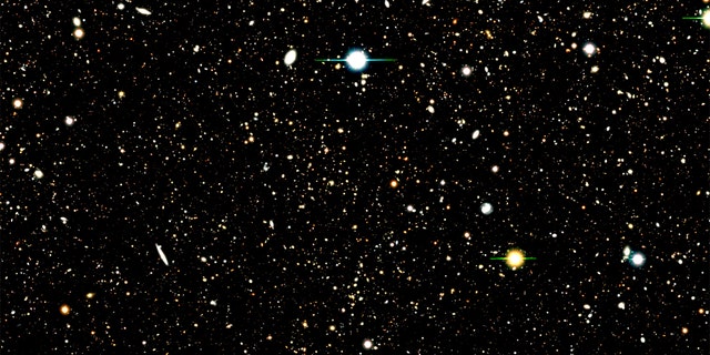 This image shows the results of a deep field survey by the Subaru Telescope. A new analysis used a Subaru deep field image to identify the location of nearly 1,300 distant galaxies. The analysis then combined the UV radiation from those galaxies to learn about their composition. A few bright supernovas can also be seen in the image.