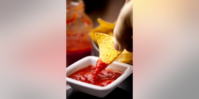 Double dippers really are leaving germs behind in the communal dip.