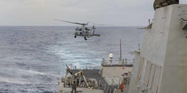 Feb 4: 2015: An MH-60R Seahawk helicopter assigned to Helicopter Maritime Strike Squadron 46 'Grandmasters' takes off from the Arleigh Burke-class guided-missile destroyer USS Farragut. (US Navy)