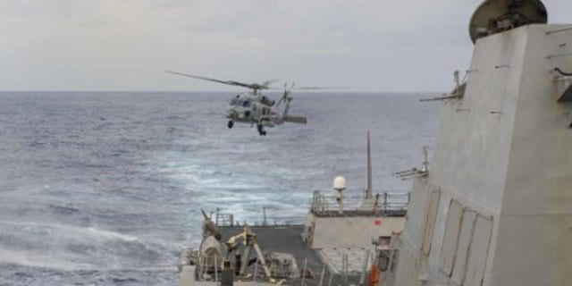 Feb 4: 2015: An MH-60R Seahawk helicopter assigned to Helicopter Maritime Strike Squadron 46 'Grandmasters' takes off from the Arleigh Burke-class guided-missile destroyer USS Farragut. (US Navy)