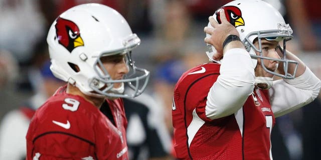 Arizona Cardinals kicker Chandler Catanzaro (7) reacts to missing a game-winning field goal as punter Ryan Quigley (9) looks on attempt during overtime of an NFL football game against the Seattle Seahawks, Sunday, Oct. 23, 2016, in Glendale, Ariz. The game ended in overtime in a 6-6 tie. (AP Photo/Ross D. Franklin)
