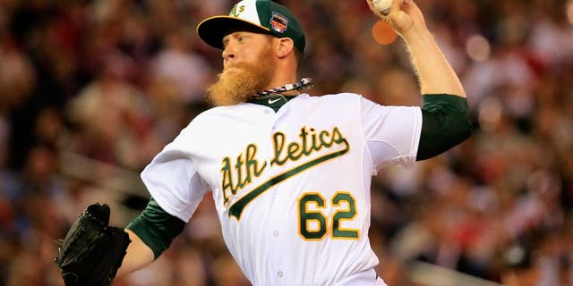 MINNEAPOLIS, MN - JULY 15: American League All-Star Sean Doolittle #62 of the Oakland Athletics pitches against the National League All-Stars during the 85th MLB All-Star Game at Target Field on July 15, 2014 in Minneapolis, Minnesota. (Photo by Rob Carr/Getty Images)